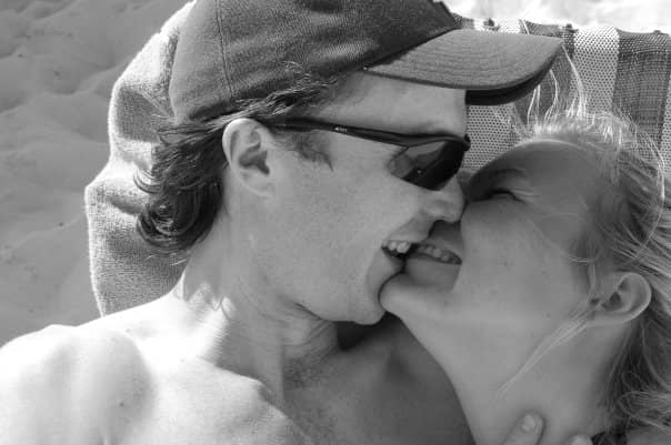 Jenn and her husband kissing in Cuba, two weeks after they left their long-term partners for each other.